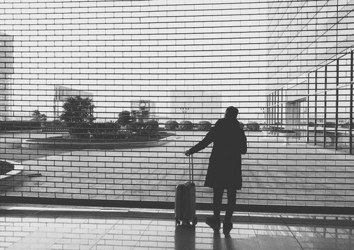 man's back in front of a rolling shutter