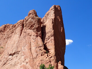 A red rock formation against the blue sky