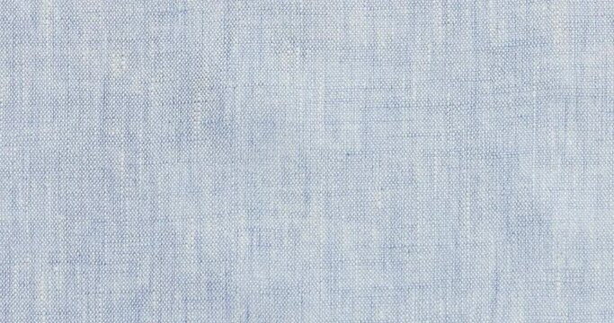 Loopable blue fabric background texture, Seamless blue fabric pattern in slow motion, 4K blank endless background. Background for titles or credits.