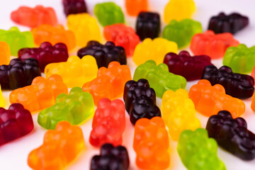 Bright multi-colored gummy bears. Background from jelly sweets.