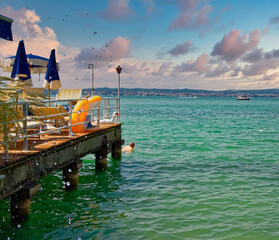 Sirmione, Italy 17 August 2018: Lake Garda. Cafe on the beach.