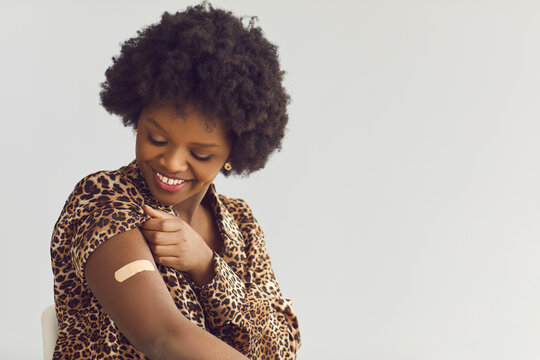 People Healthcare And Protection, Coronavirus Vaccination, Happy Smiling Satisfied African American Woman Getting Covid19 Vaccine Headshot Portrait Studio Grey Background With Copy Space