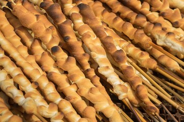 Street food in Ukraine -  Dyvny, Ukrainian National dessert on a reed sticks baked mostly for weddings and other celebrations