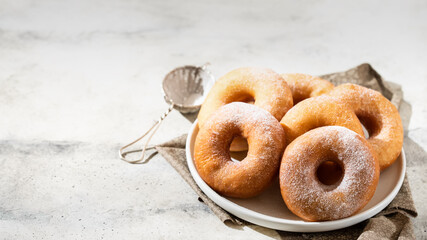 Homemade donuts on grey cement background. Food concept.