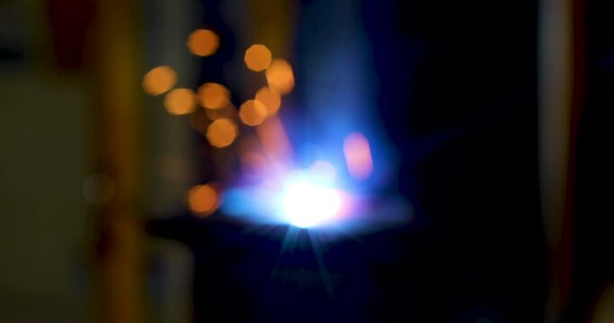 Blur of Technology background and texture for video.  flare light effect of metal welding or blacksmith works at lathe industrial manufacturing factory