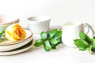 ceramic tableware with flowers on white background