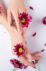 female hands and flowers
