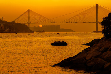 Suspension bridge in Hong Kong under sunset