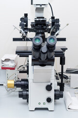 Modern microscope in biotech lab. Equipment in laboratory of Fertilization.