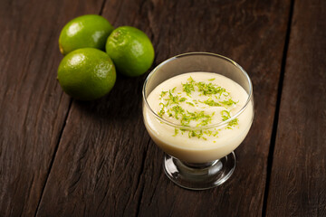 Lemon mousse with lemon zest on top.