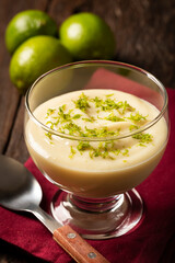 Lemon mousse with lemon zest on top.