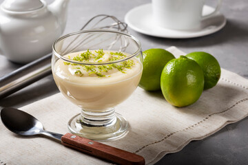 Lemon mousse with lemon zest on top.