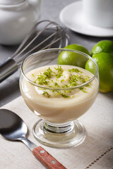 Lemon mousse with lemon zest on top.