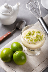 Lemon mousse with lemon zest on top.