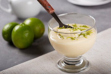 Lemon mousse with lemon zest on top.