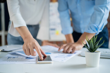 Asian teams start ups are brainstorming about a new project in the office.