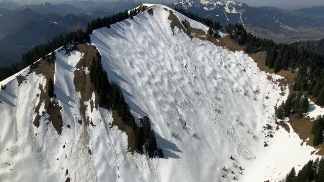Snow avalanche in the alps on Schönberg in Bavaria, Germany, Aerial shot in 4k in winter 2021, drone