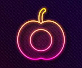 Glowing neon line Peach fruit or nectarine with leaf icon isolated on black background. Vector