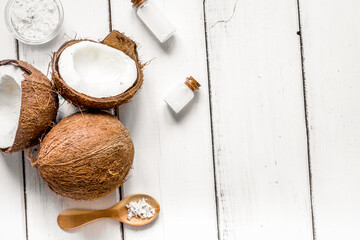 Fototapeta na wymiar organic cosmetics concept with coconut on table background top view