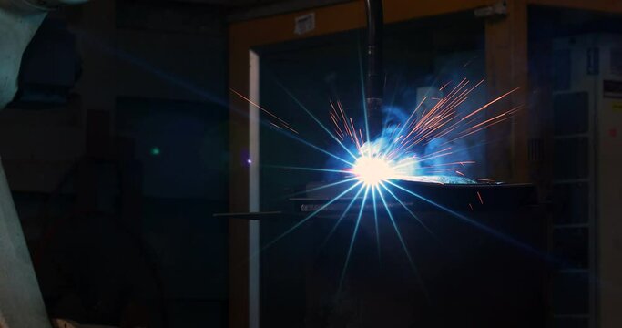 Technology background and texture for video.  flare light effect of metal welding or blacksmith works at lathe industrial manufacturing factory