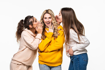 Three attractive girls gossiping isolated on white background
