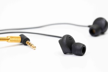 Top view in ear headphone isolate on white background , Black gold headphones.
