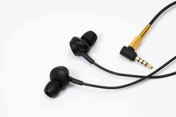 Top view in ear headphone isolate on white background , Black gold headphones.