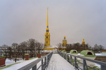 View of the Peter and Paul Fortress (St. Petersburg, Russia) on a spring cloudy day. The complex of...