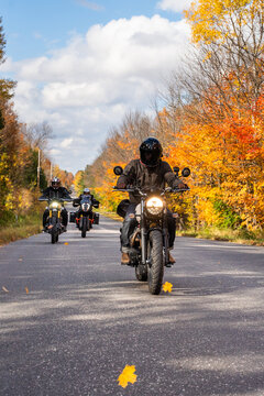 Group of friends riding motorcycles in the fall in Canada