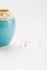 Colorful vase and flower arrangement apricot flowers on white background