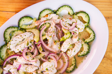 Traditional Mexican seafood. Aguachile, Mexican seafood food with copy space. Mexican seafood on wooden table. Traditional Mexican food concept.