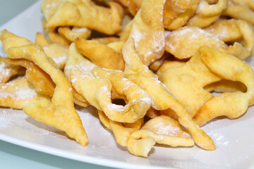 Brush cookies on a plate. Close-up. Selective focus. Background.