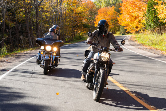 Group of friends riding motorcycles in the fall in Canada