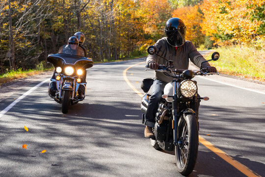 Group of friends riding motorcycles in the fall in Canada