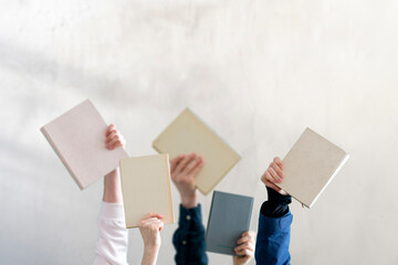 people hands holding books, learning and studying, knowledge education
