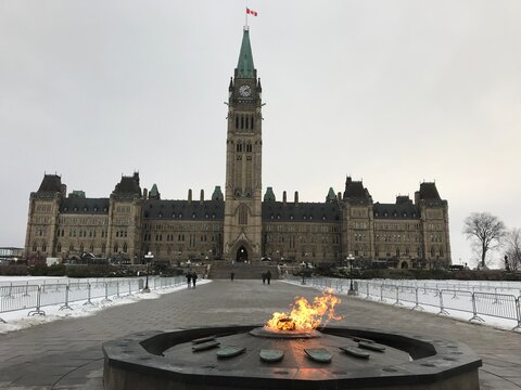 Centennial Flame memorial on Parliament Hill in front of the Canadian Parliament Centre block. Winter time. Ottawa, Ontario, Canada.