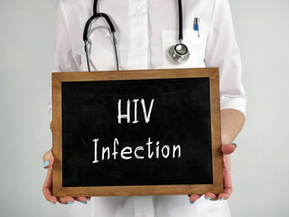 Healthcare concept meaning HIV Infection with inscription on the piece of paper.