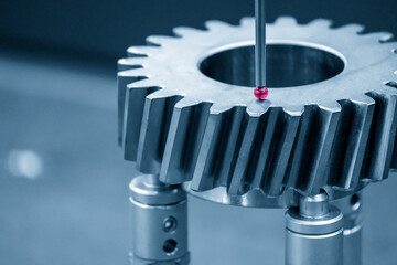 The  CMM machine checking the dimension  the bevel gear part . The quality control of mechanical...