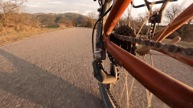 Bicycle roller chain and gear while cycling (first person perspective pov view)