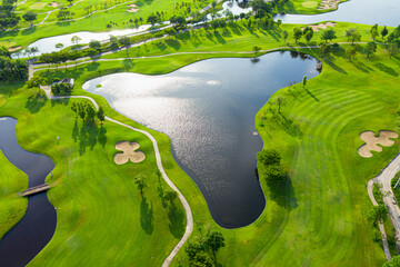 Golf course beautiful Aerial view of golf field landscape with sunrise view in the morning shot. Bangkok Thailand