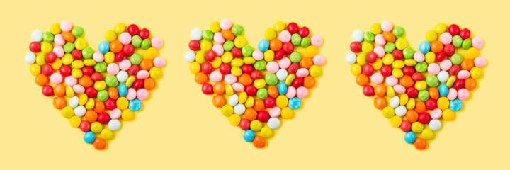 Old fashion pale multi colored candy heart background