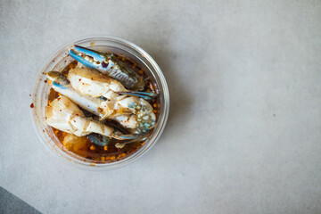 Spicy salad with blue crab in box