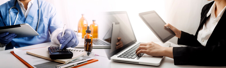Health care researchers working in life science laboratory and analyzing microscope slides in...