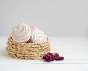 Coffee marshmallow on a white wooden background with yellow bokke. Light dessert for the holiday
