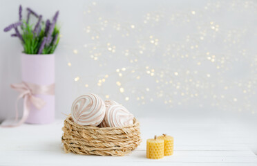 Coffee marshmallow on a white wooden background with yellow bokke. Light dessert for the holiday