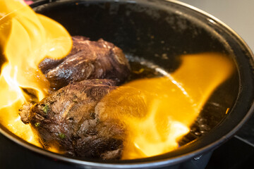 Two pieces of beef roast in a casserole dish