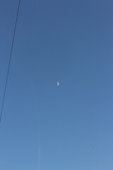 Clear blue skies with passengers being flown through it