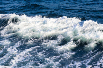 White crest of a sea wave. Selective focus. Shallow depth of field