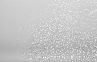 Drops of water on a color background. Selective focus. Gray
