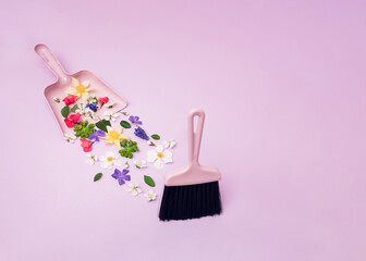 A plastic brush that cleans flowers and inserts them into a plastic spatula on a purple background.